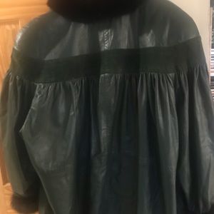 Beautiful dark green coat. Made of genuine leather